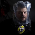 Phil Burns demonstrates the air purifying SCape Mask at his home in American Fork